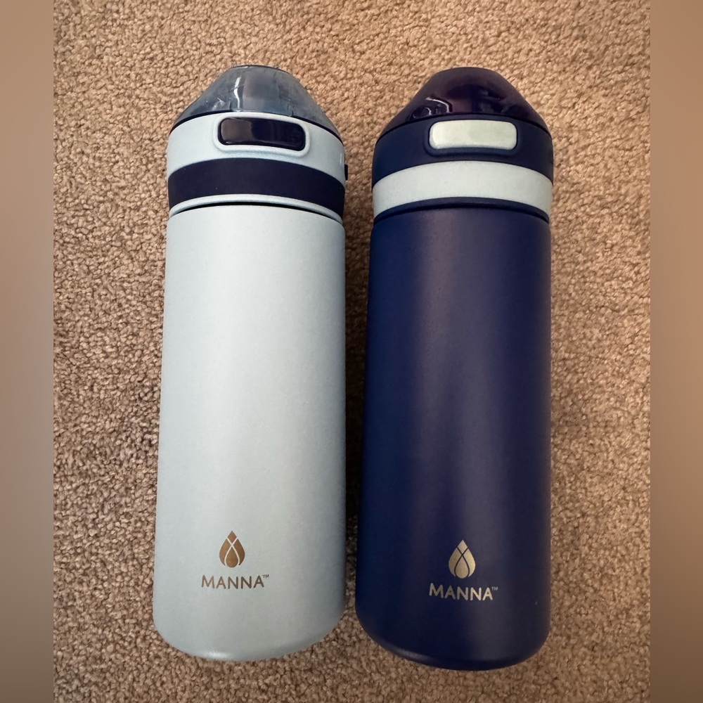 (2) Manna 18oz bottle - brand new - light baby blue color and darker blue color